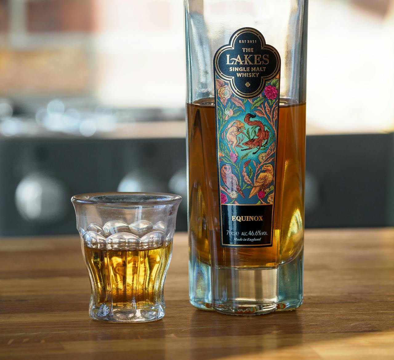 a-bottle-and-glass-of-whisky-standing-on-a-wooden-table-20229253 Buy whisky online Australia